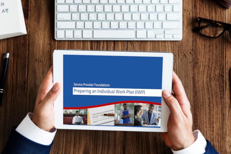 individual holding tablet with Preparing an Individual Work Plan (IWP) Service Provider Foundations module displaying on screen individual holding tablet with Preparing an Individual Work Plan (IWP) Service Provider Foundations module displaying on screen